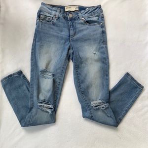 Distressed ripped jeans